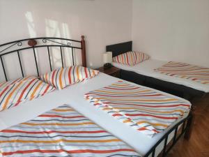 Postel nebo postele na pokoji v ubytování Apartman Mira