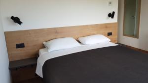 Postel nebo postele na pokoji v ubytování Casa Grzina