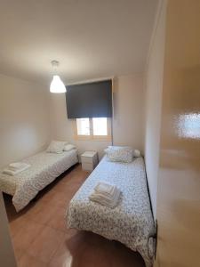 Llit o llits en una habitació de Apartamento Bajamar