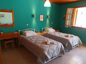 Posteľ alebo postele v izbe v ubytovaní Dimitri's Seaview Studio - Lakka Paxos