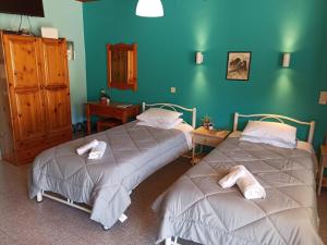 Posteľ alebo postele v izbe v ubytovaní Dimitri's Seaview Studio - Lakka Paxos
