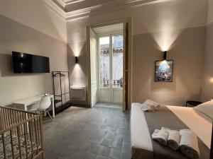 a hotel room with a bed and a staircase at Ruanera in Catania