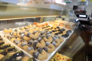 a display case with many different types of donuts at VICKY'S HOUSE in Parghelia