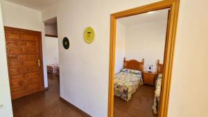 En eller flere senge i et værelse på Bonanza - 40 metros de la playa!