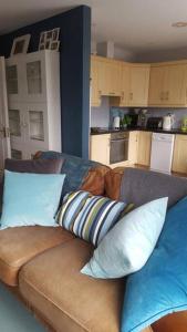 a couch with pillows on it in a kitchen at Galway City Lovely 2 Bed Apartment in Galway