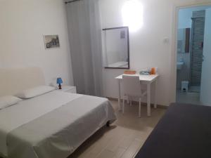 Postel nebo postele na pokoji v ubytování B&B Porta Romana Amelia