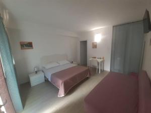 Postel nebo postele na pokoji v ubytování B&B Porta Romana Amelia