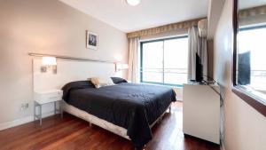 Кровать или кровати в номере Amplio, moderno e impecable departamento en la mejor ubicacion de Mendoza