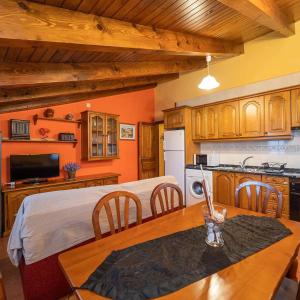 a kitchen with a bed and a table in a room at Turismo Rural Castell in Neril