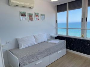 Säng eller sängar i ett rum på Duplex Bonaire Playa de Gandia a 1ra linea