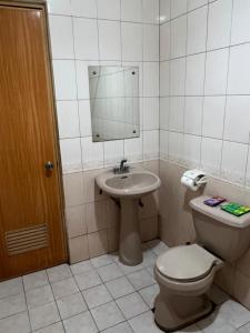 a bathroom with a toilet and a sink at INN D’ZaireH in Molino