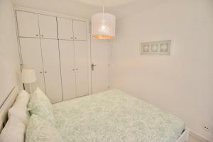 Postel nebo postele na pokoji v ubytování Sweet Home Apartaments