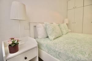 Postel nebo postele na pokoji v ubytování Sweet Home Apartaments