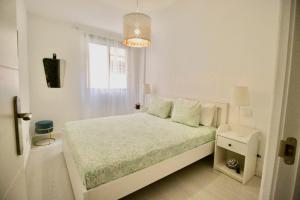 Postel nebo postele na pokoji v ubytování Sweet Home Apartaments