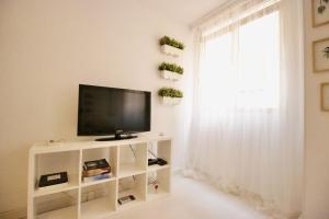 TV a/nebo společenská místnost v ubytování Sweet Home Apartaments