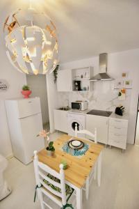 Kuchyň nebo kuchyňský kout v ubytování Sweet Home Apartaments