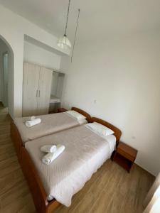 Postel nebo postele na pokoji v ubytování NAFSIKA Apartments