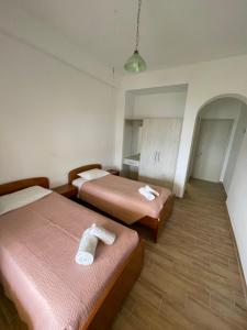 Postel nebo postele na pokoji v ubytování NAFSIKA Apartments
