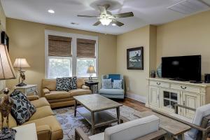 a living room filled with furniture and a flat screen tv at North Beach Coastal Breeze in Myrtle Beach