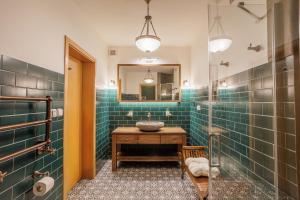 a bathroom with a sink and a mirror at Apartmány Mind Adventure in Lštění +53 photos