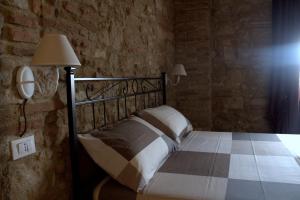 Posteľ alebo postele v izbe v ubytovaní Agriturismo Fonte Belvedere