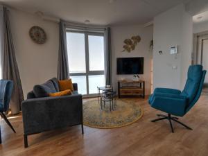 A seating area at Premium apartment in Scherpenisse with roofed terrace