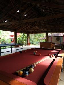 a pool table with balls on top of it at Sarandy Hotel Eco Parque in Paraíba do Sul