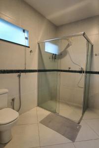 a bathroom with a shower and a toilet at Boulevard in Manaus