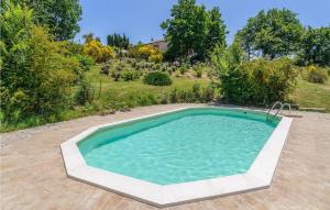 a swimming pool in the middle of a yard at Rondine in Smirra