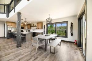 a kitchen and dining room with a table and chairs at 24 KARAT Lodge at Terry Peak in Lead