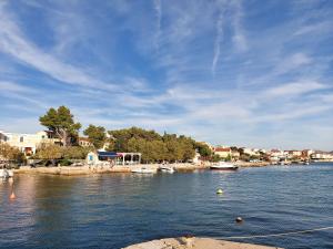 a view of a body of water with boats at Apartment APARTMAN MIA in Brodarica