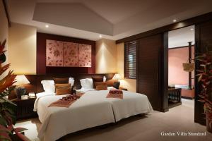 Ein Bett oder Betten in einem Zimmer der Unterkunft Bo Phut Resort and Spa - SHA Plus