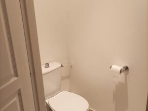 a bathroom with a toilet and a roll of toilet paper at Appartement T3 dans Château avec Piscine et Sauna à Jausiers - 6 pers, 55m² - FR-1-165B-32 in Jausiers +3 photos