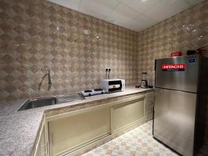 Kuchyň nebo kuchyňský kout v ubytování Aalia Hotel Suites
