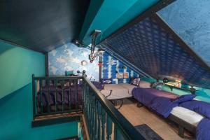a attic room with two beds and a staircase at Villa Amarina in Trogir +49 photos