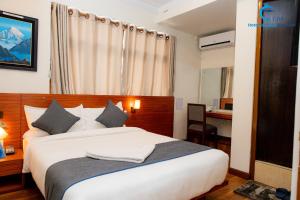 Postel nebo postele na pokoji v ubytování Hotel Dreams connect GRB