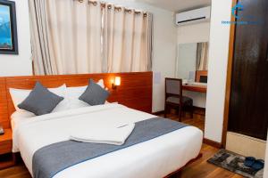 Postel nebo postele na pokoji v ubytování Hotel Dreams connect GRB