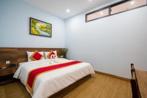 Postel nebo postele na pokoji v ubytování Golden Field Villa Hoi An