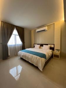 Postel nebo postele na pokoji v ubytování Aalia Hotel Suites