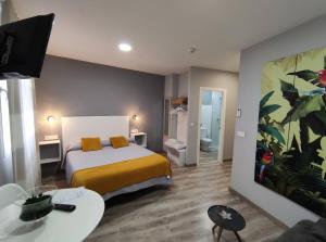 Posteľ alebo postele v izbe v ubytovaní Apartamentos Harmonia