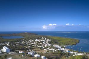 an aerial view of a city and the ocean at Happy Days Villa C in Fajardo