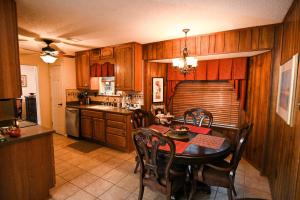 a kitchen with a table and a dining room at Comfortable, Convenient, Great Value in Mobile