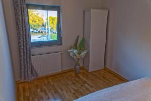 Postel nebo postele na pokoji v ubytování Urbana Villa Four season