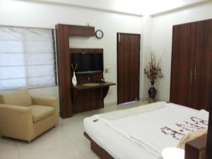 Uma cama ou camas num quarto em Sovereign Residency