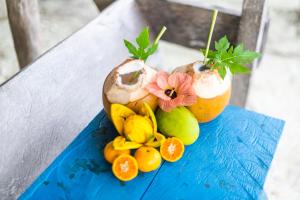 a pile of fruit on a blue table at Tailana Island Pulau Banyak in Alaban