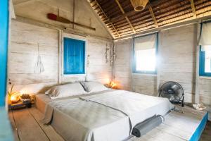 Ένα ή περισσότερα κρεβάτια σε δωμάτιο στο Tailana Island Pulau Banyak