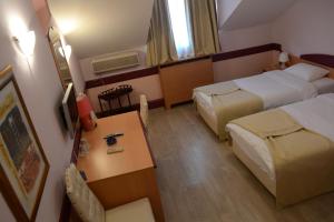 Ένα ή περισσότερα κρεβάτια σε δωμάτιο στο Hotel Tomce Sofka