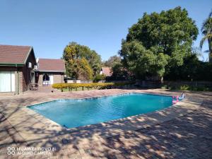 a swimming pool in the backyard of a house at Albatros@21 in Newcastle