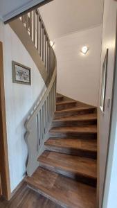 a staircase in a home with wooden floors at Ferienhaus am großen Waldstein in Zell im Fichtelgebirge