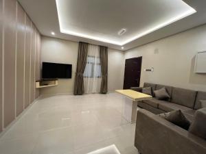 TV a/nebo společenská místnost v ubytování Aalia Hotel Suites